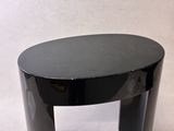 a black table with a glass top on a white background