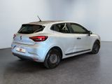 the rear end of a white car in a white room