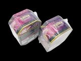 two packs of pokemon cards sitting on top of each other