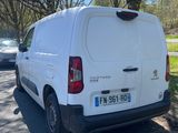 a white van that is parked on the side of the road