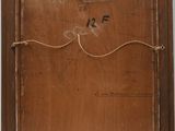 an old picture of a wooden frame with a number on it