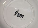 a white plate with a black and white design on it