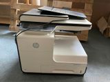a printer that is sitting on top of a table