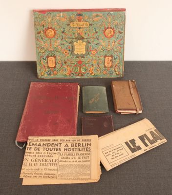several old books are sitting on a table next to a box