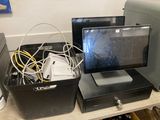 a desk with a monitor, keyboard, mouse, and other electronics on it
