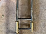 a brass instrument that is laying on the floor