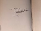 an open book with writing on it sitting on top of a table