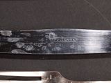 a knife and a fork sitting on a table