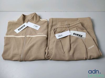 two pairs of men ' s sweatpantss sitting on top of a table