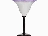a purple and white glass vase on a black stand