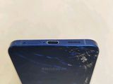 the back of a cell phone with a cracked screen