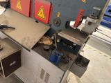 an image of a machine that is working on a piece of wood