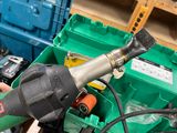 a person using a cordless drill to fix a piece of metal