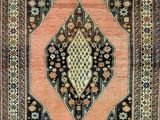 a rug with a diamond design on a black ground