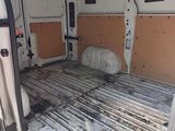 a white van that has been vandalized and is parked