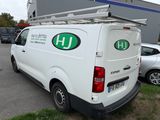 a white van that is parked in a parking lot
