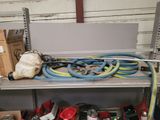 a bunch of tools on a shelf in a garage