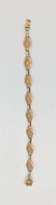 bracelet plaqué or jaune, orné d'un motif en spirale sur le côté