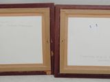 two framed pictures of a couple of brown frames on a white wall