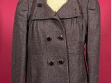 grey wool peale coat on a mannequin dummy
