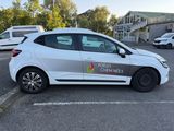 a white car parked in a parking lot with other cars in the background