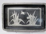 a tray with a picture of a bird and flowers on it