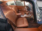 a brown car with leather seats in the back of it