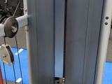 a close up of a gym equipment with a blue mat