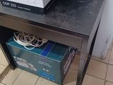 a microwave sitting on top of a table in a kitchen