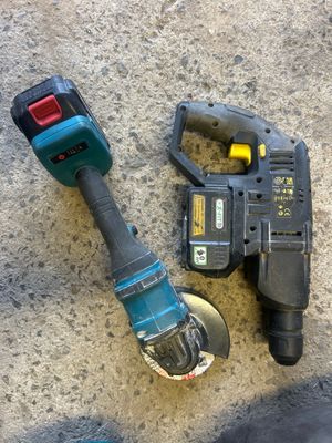 a cordless drill and a cordless hammer on the ground
