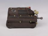 a brown machine that is sitting on a white surface
