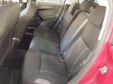 a red car with black seats in the back of it