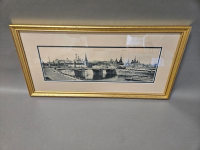 a picture of a picture of a picture of a city in a gold frame
