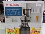 une boîte sur laquelle figure l'image d'un extracteur de jus
