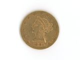 une pièce d'or sur laquelle est représentée la tête d'une femme