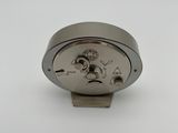 an image of a close up of a metal object on a white surface