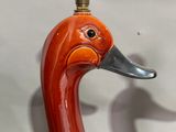 a lamp that has a bird on top of it