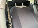 a car with a seat covered in a car seat cover