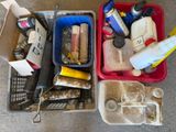 two bins filled with assorted items sitting on the floor