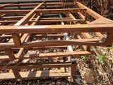 a wooden structure that has been built in the woods