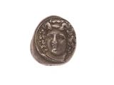 une image d'une pièce de monnaie sur laquelle figure le visage d'un homme