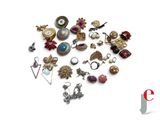 many different types of jewelry on a white surface