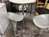 two stools and a table in a garage