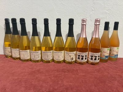 six bottles of wine are lined up on a table