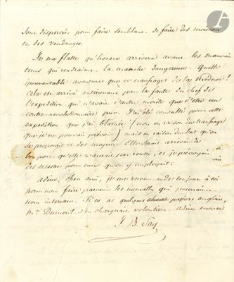 un vieux document écrit posé sur une table
