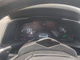 a car dashboard with a speedometer and a steering wheel