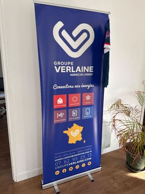 a blue banner with a heart on it in the corner of a room