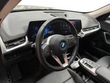 the interior of a car with a steering wheel, dashboard, and dashboard controls