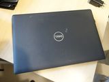dell laptop on a table in a home office setting