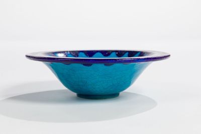 bowl with blue glaze glaze on a white background